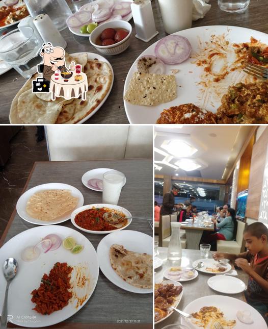 Among different things one can find food and dining table at Hotel The Grand Bansari - Banquet Hall, Fast Food Restaurant, Gujarati Restaurant