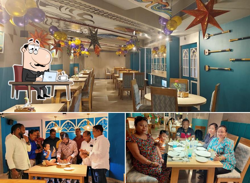 Take a seat at one of the tables at Surfers Restaurant, Puri