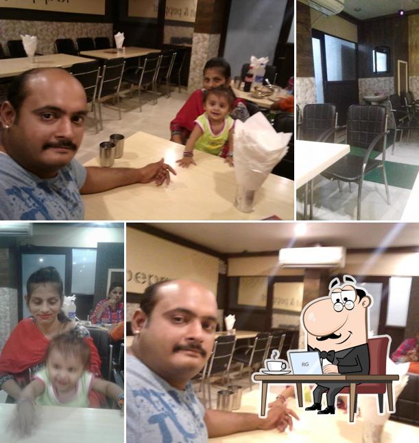 Take a seat at one of the tables at Amarpali's Food And Restaurant