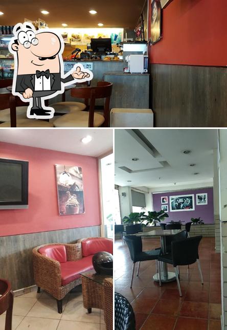 Take a seat at one of the tables at Café Coffee Day