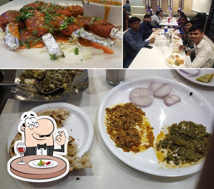 Check out the photo showing food and dining table at Tulsi Restaurant