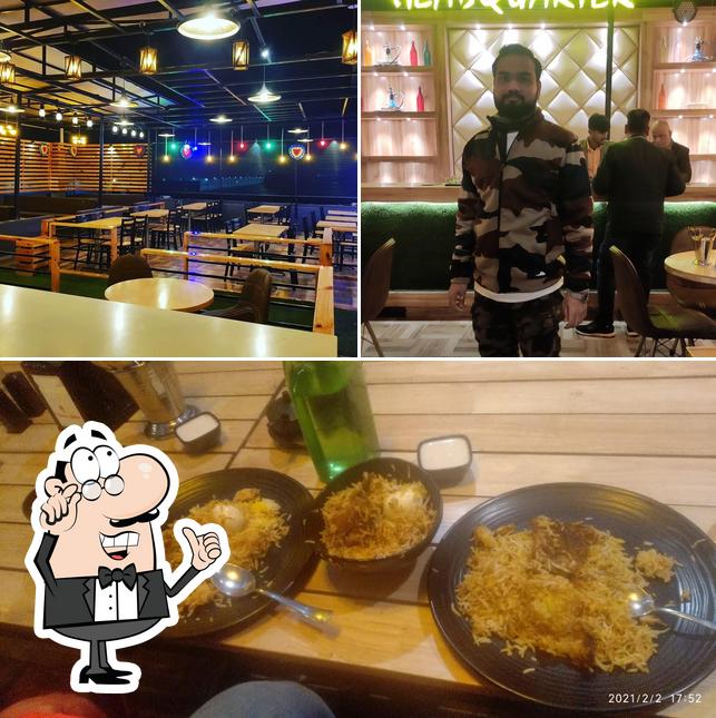 Take a look at the image showing interior and food at Headquarter Roof Top Cafe
