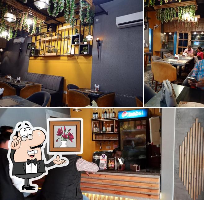 Take a seat at one of the tables at Ambiance Cafe & Dine