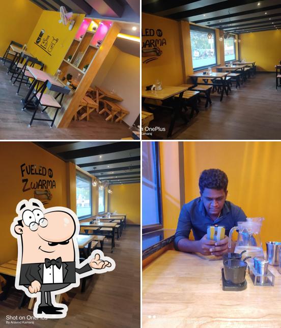 The interior of ZWARMA THE FAMILY RESTAURANT ( the shawarma makers ) ( veg - non veg ) ( 100 % Halal )