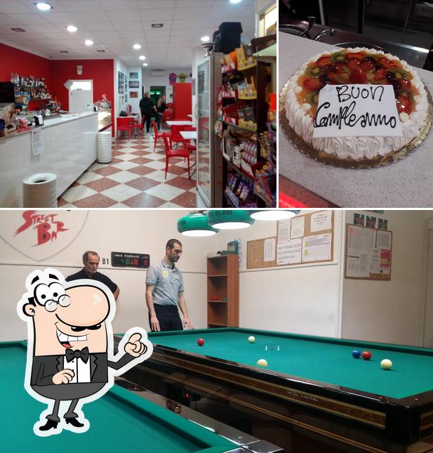 Dai un’occhiata alla immagine che mostra la interni e torta di Street Bar