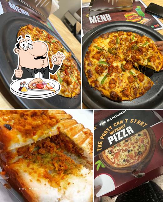 Try out pizza at The Sandwich Club Sandwiches, Burgers, Momos, Wraps, Brownies, Pasta and Pizza