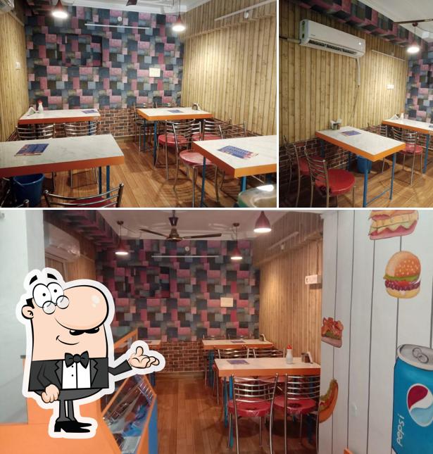 Take a seat at one of the tables at OOZE PIZZA