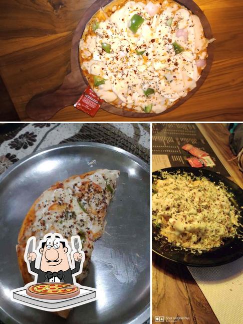 Get pizza at Chai Choupati Cafe