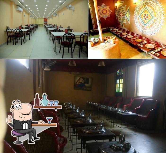 Take a seat at one of the tables at Shri Thaal Village, Ajmer Road