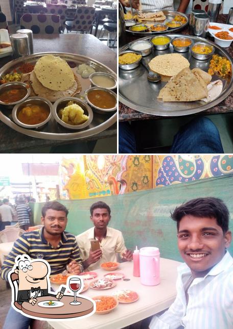 Among different things one can find food and dining table at Hotel Savera