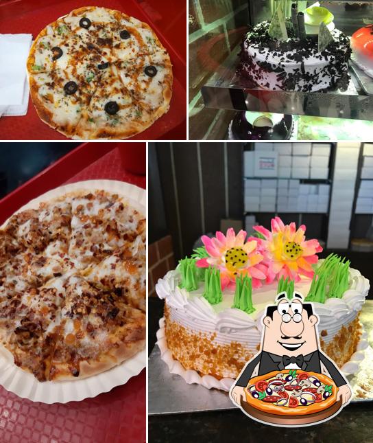 Get pizza at Cakes & Bakes