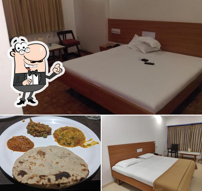 Check out the photo displaying interior and food at Purnima Regency