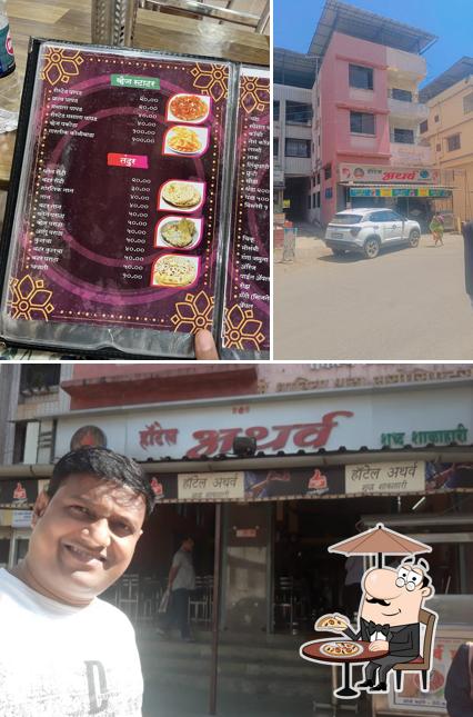 Check out the image displaying exterior and food at Hotel Atharva