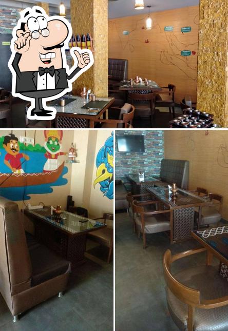 Take a seat at one of the tables at Thangabali - Mahim
