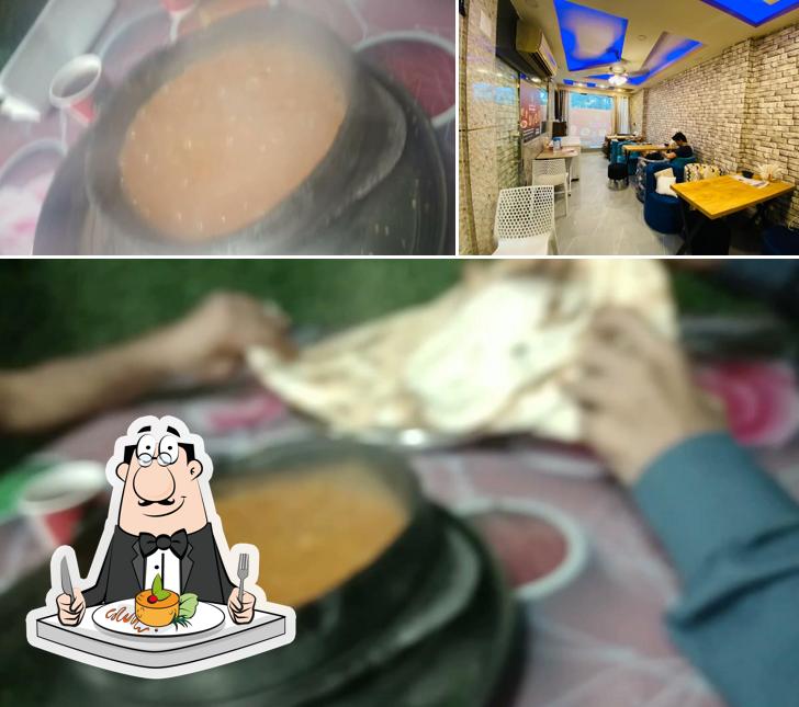 Check out the image depicting food and interior at Bait Al Mandi