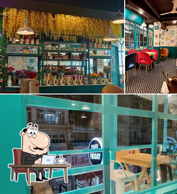 Take a seat at one of the tables at CAFE FRIDAY - Best Restaurant In Solan( Most Instagrammable Cafe ) 100% Vegetarian