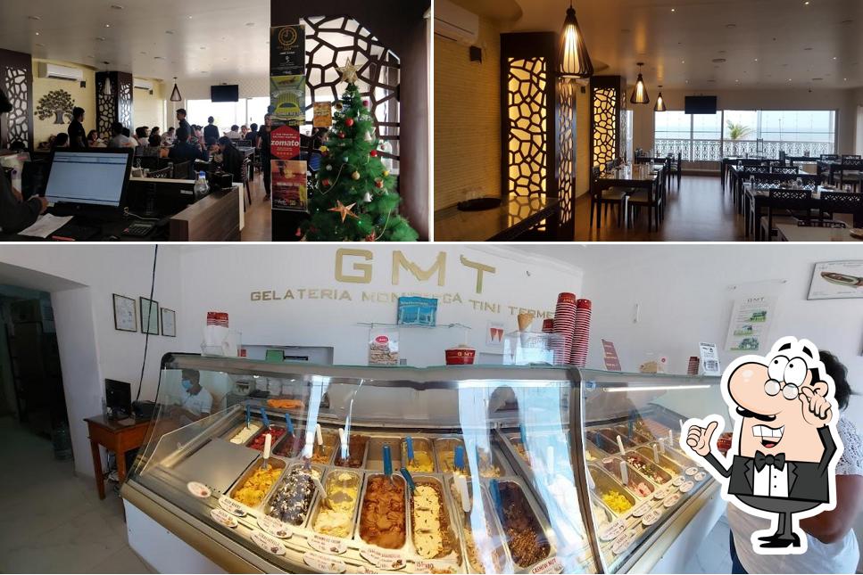 Take a seat at one of the tables at Escape in Best Restaurant Cafe Rock Beach View near by White Town Sea Foods Top in Pondicherry