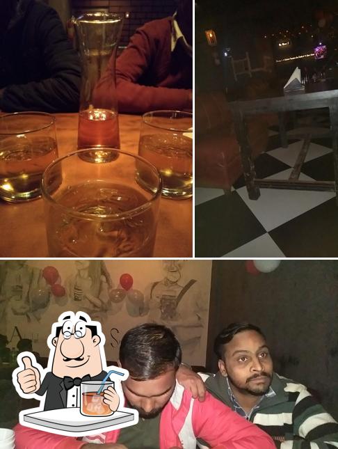 This is the image showing drink and interior at नंद दा ढाबा