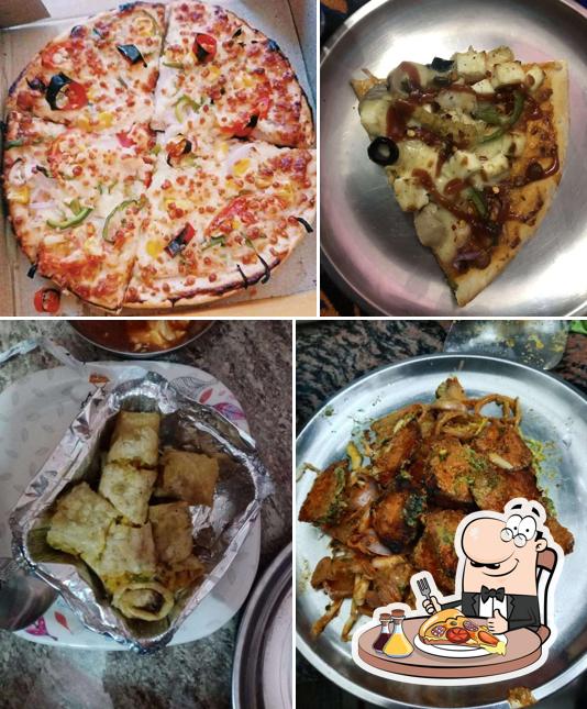 Get pizza at Swaad Sweets Pizza and Cafe