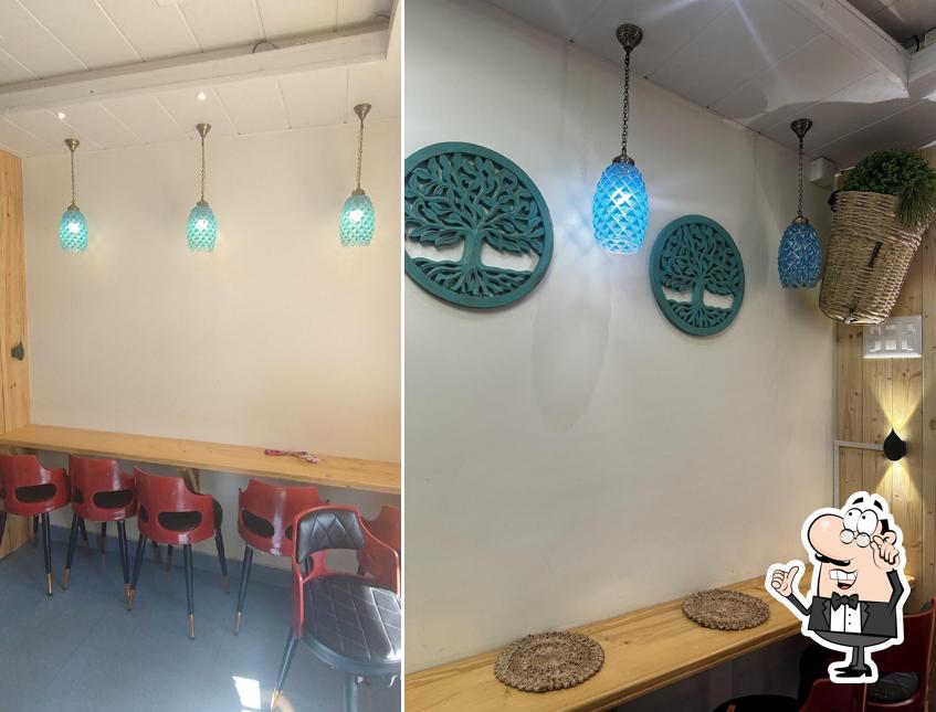 Take a seat at one of the tables at HIMACHALI FLAVOURS