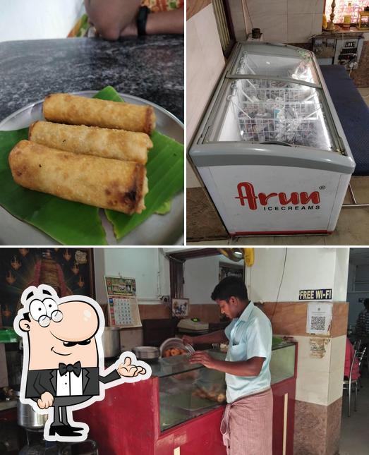 Check out the image depicting interior and sandwich at Ganesh Bhavan Thiruvarur