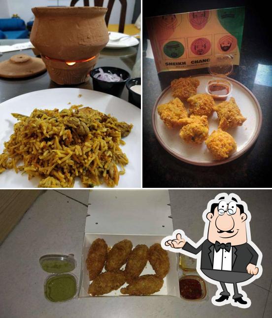 Take a look at the picture showing interior and food at Sheikh Chang Singh