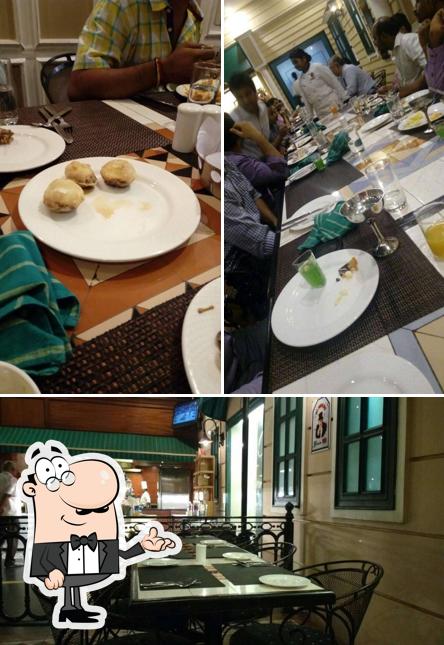 Take a seat at one of the tables at Main Street - The Residency Towers
