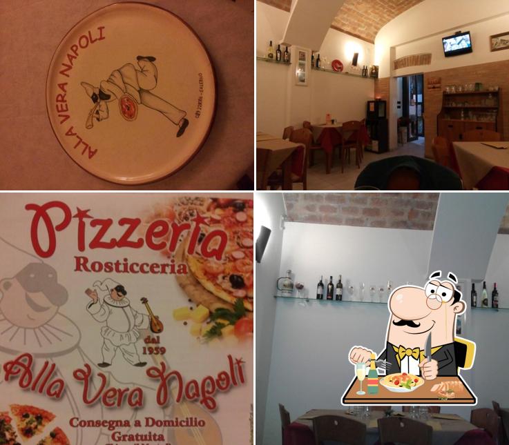 Tra le diverse cose da Alla Vera Napoli si possono trovare la cibo e tavolo da pranzo