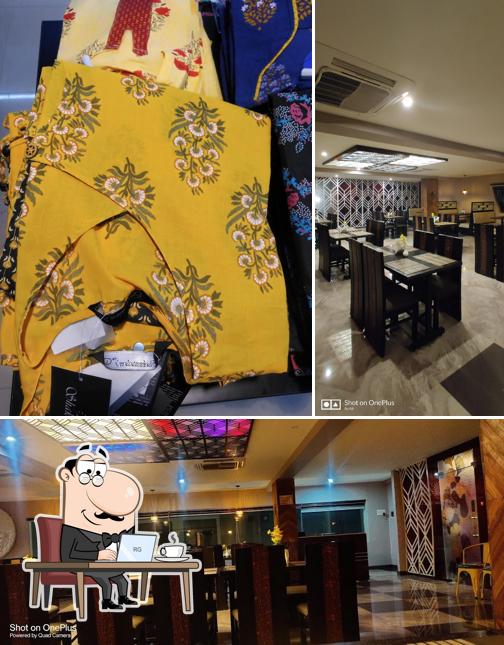 This is the image showing interior and dining table at Karunya Family Restaurant