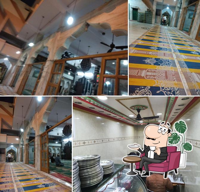 Take a seat at one of the tables at Kamaal sweet House