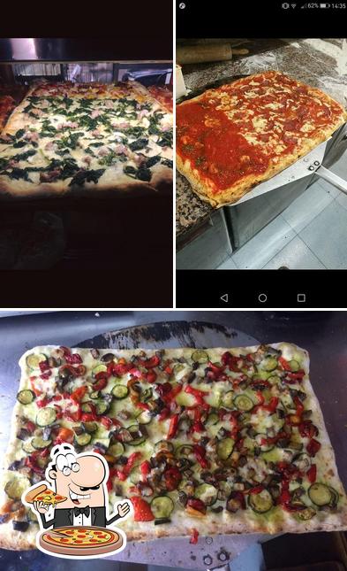 Prenditi una pizza a Pizzeria Tavola Calda
