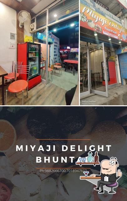 Take a look at the image displaying interior and food at Miyaji delight