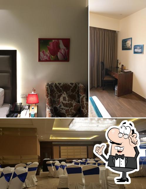 Take a seat at one of the tables at WJ Grand Hotel