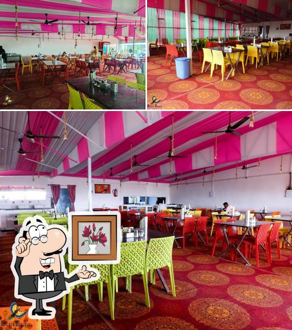 Take a seat at one of the tables at Hotel Pink City