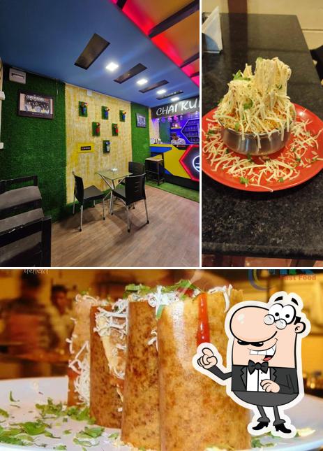 This is the image displaying interior and food at BALAJI CHARCOAL DOSA