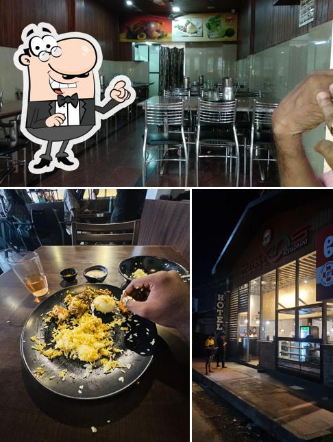 Take a seat at one of the tables at Hotel Kins