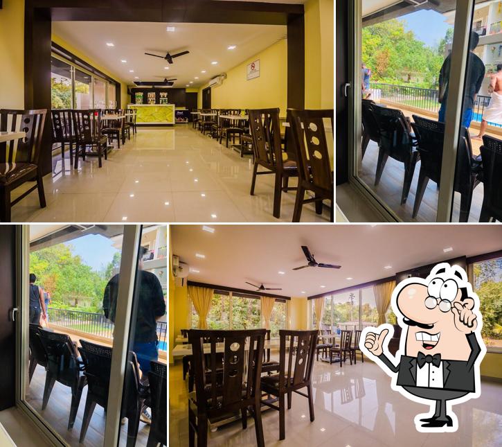 Take a seat at one of the tables at Chilli N Spice Restaurant