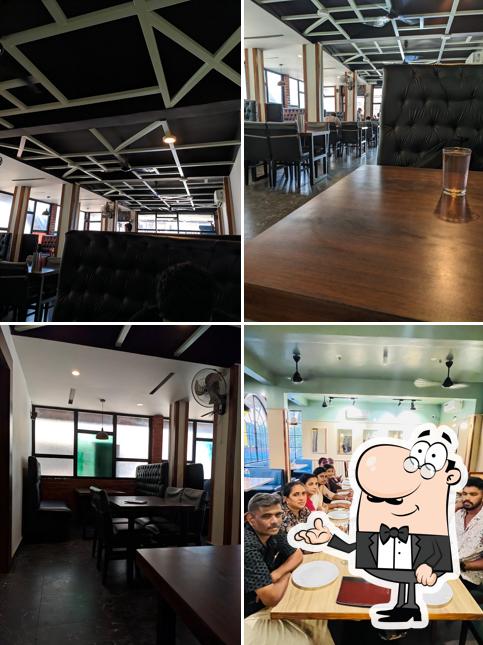 Take a seat at one of the tables at Thawa Family Restaurant cherkala