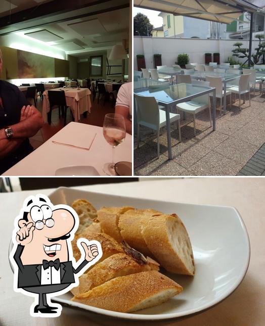 Questa è la immagine che presenta la interni e cibo di Antico Stemma