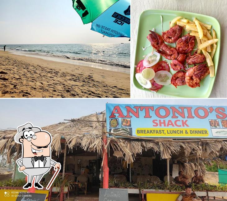 The photo of exterior and food at Antonio's Guest House And La Pargola Shack