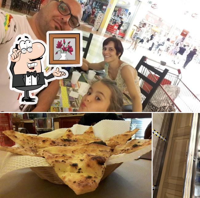 Guarda la foto che presenta la interni e pizza di Villa Pizza Guarda la foto che presenta la interni e pizza di Villa Pizza