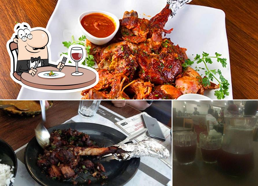 Among various things one can find food and bar counter at Empire Restaurant Kammanahalli