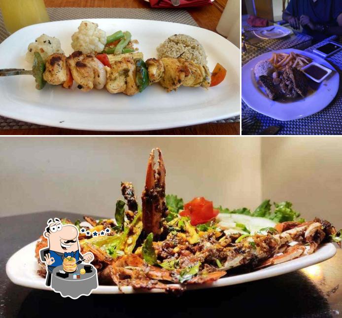 Among different things one can find food and dining table at Villa Krish