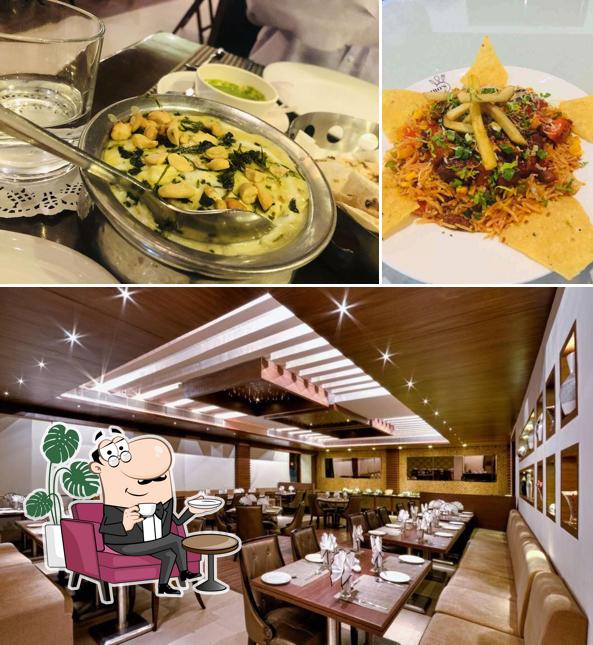 Take a seat at one of the tables at Ripples - Avalon Hotel