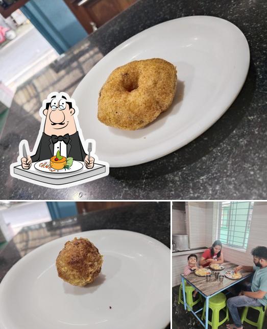 The photo of Hotel Bhavani’s food and interior