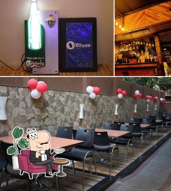 Check out the image showing interior and beer at OBluez Restaurant and Bar