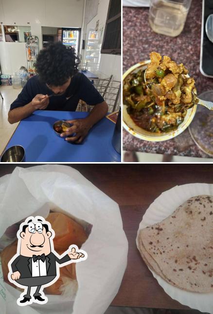 Take a seat at one of the tables at Rajasthani Restaurant