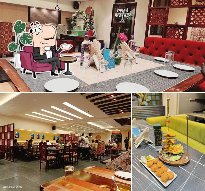 Take a seat at one of the tables at VRINDAM BHOG