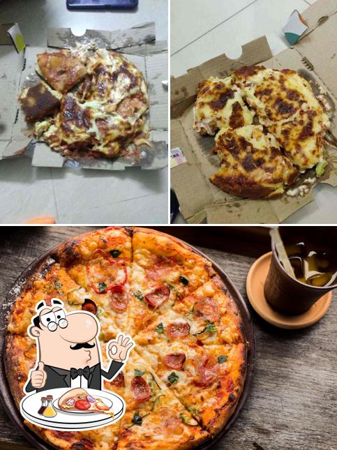 Get pizza at Woody's Pizzeria