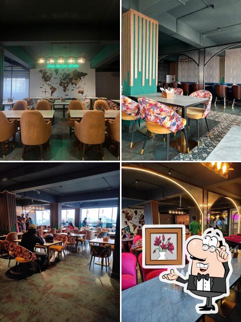 Take a seat at one of the tables at Austaara - Fine Dine & Cafe